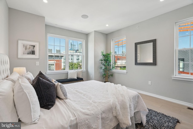 bedroom with hardwood / wood-style floors