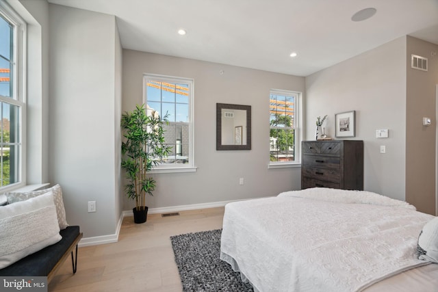 bedroom with light wood-type flooring