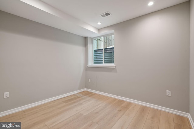 spare room featuring light hardwood / wood-style floors