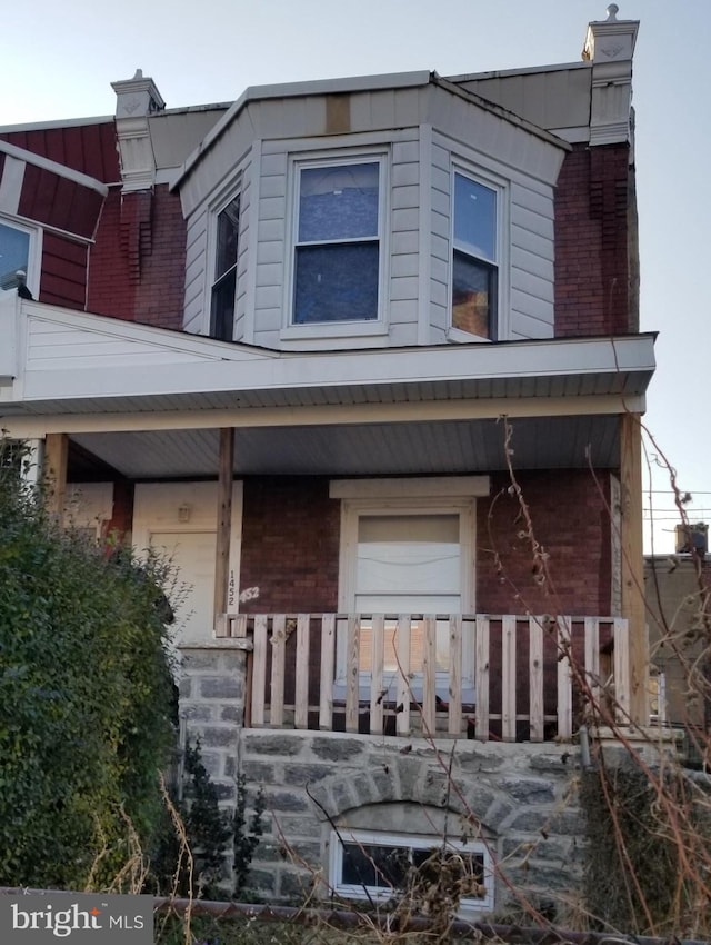 view of front of home featuring covered porch