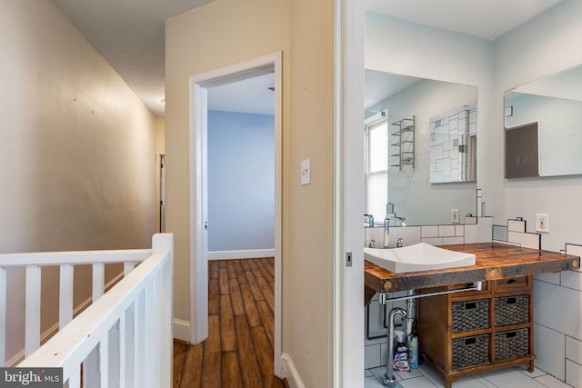 bathroom featuring sink and hardwood / wood-style flooring