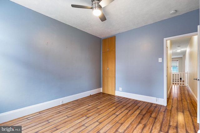 spare room featuring ceiling fan, a textured ceiling, and hardwood / wood-style flooring