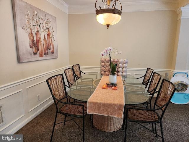 dining space with ornamental molding, carpet floors, and ornate columns