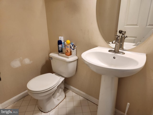 bathroom featuring tile patterned floors and toilet