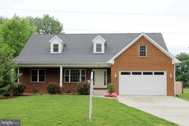 view of front of home with a garage and a front yard