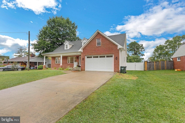 view of front of property featuring a garage and a front lawn