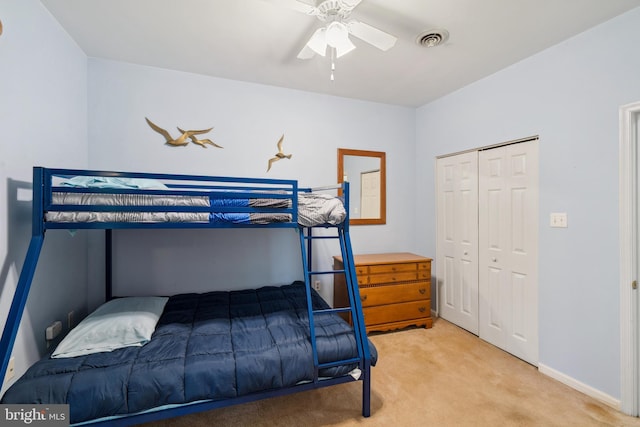 bedroom with carpet flooring, a closet, and ceiling fan