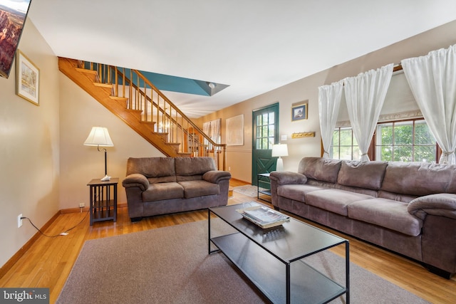 living room featuring a healthy amount of sunlight and hardwood / wood-style flooring