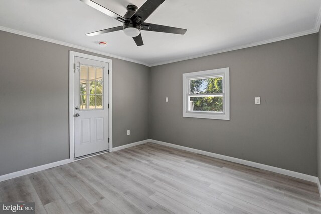 unfurnished room with ornamental molding, a wealth of natural light, ceiling fan, and light hardwood / wood-style floors