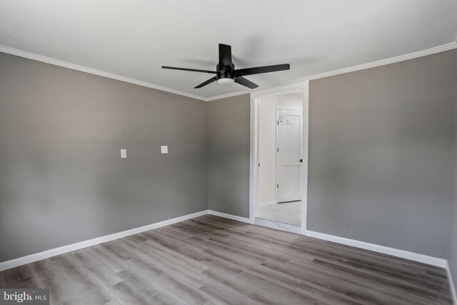 unfurnished room with ceiling fan, ornamental molding, and light wood-type flooring