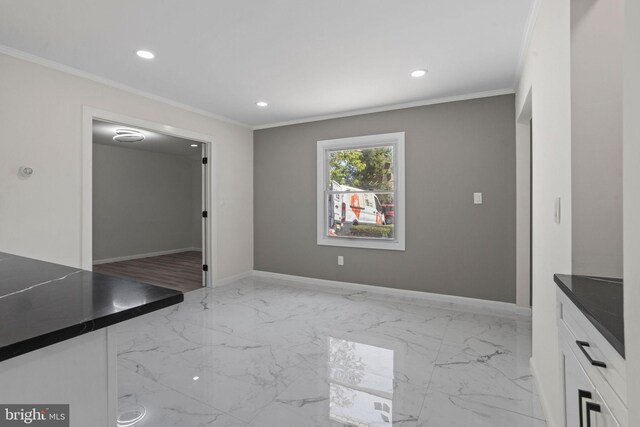 interior space with crown molding