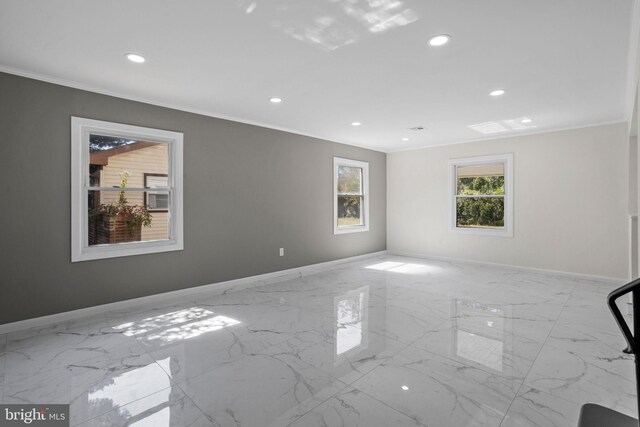 spare room with crown molding