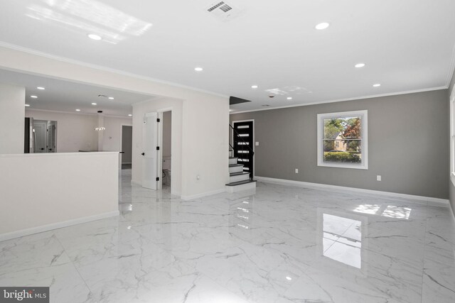 spare room featuring ornamental molding