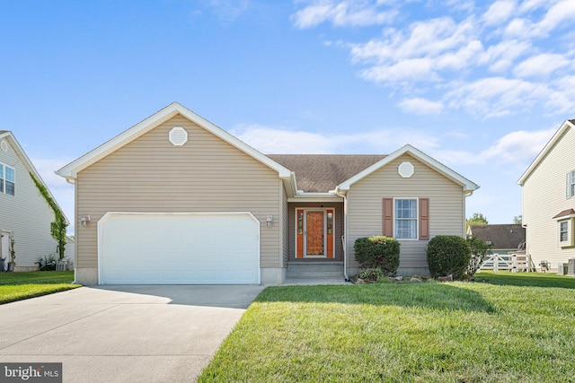 single story home featuring a garage and a front lawn