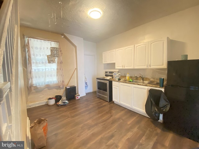 kitchen with electric stove, white cabinetry, a textured ceiling, dark wood-type flooring, and black fridge