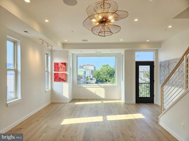 entrance foyer with light hardwood / wood-style flooring