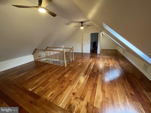additional living space featuring vaulted ceiling, ceiling fan, and wood-type flooring