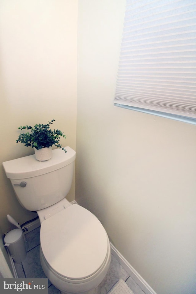 bathroom featuring tile patterned flooring and toilet