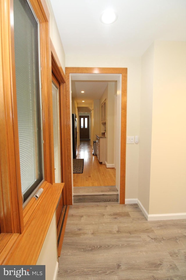 hall with light wood-type flooring