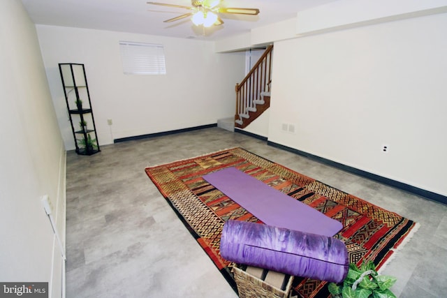 interior space featuring concrete flooring and ceiling fan