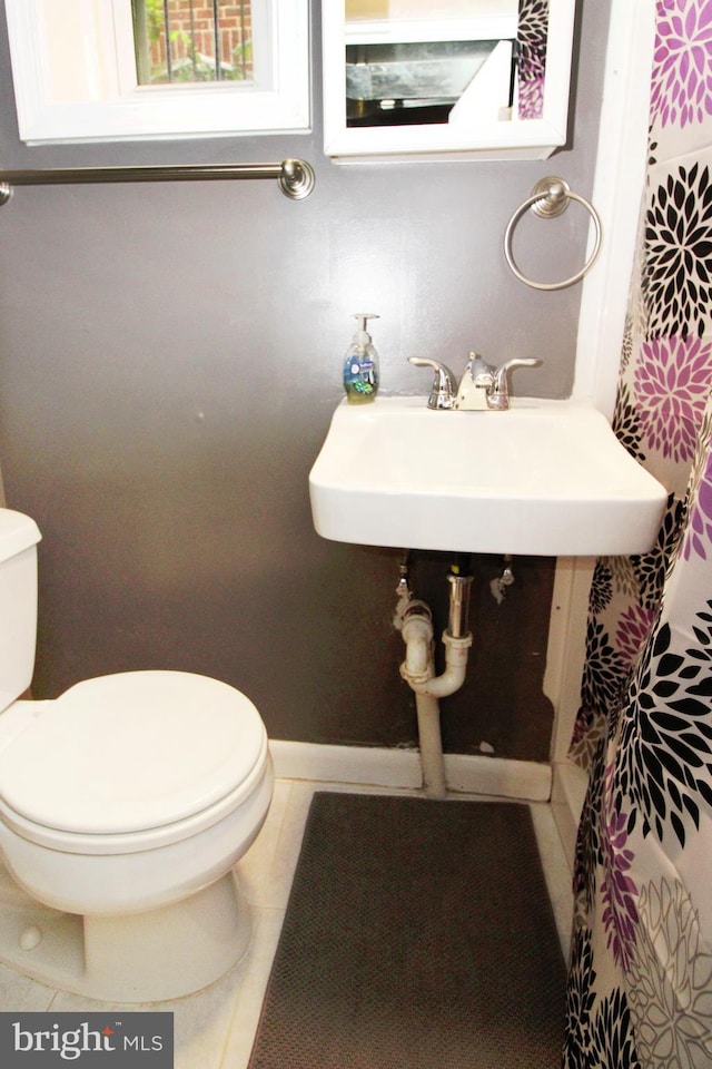 bathroom with sink and toilet