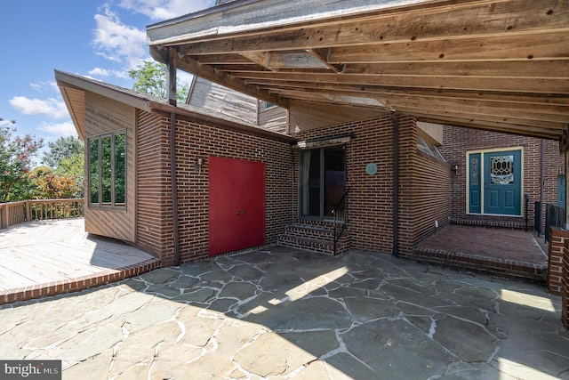 exterior space featuring a deck and a patio