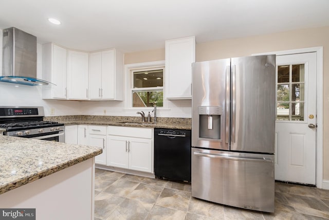 kitchen with light stone counters, stainless steel appliances, wall chimney exhaust hood, and white cabinetry