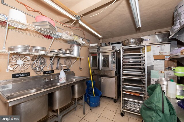 3000 N 24th St, Philadelphia, PA 19132 - basement with light tile patterned flooring