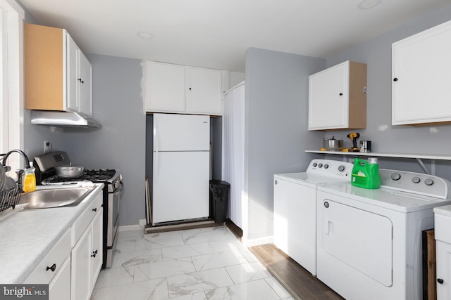 3000 N 24th St, Philadelphia, PA 19132 - washroom featuring baseboards, laundry area, independent washer and dryer, marble finish floor, and a sink