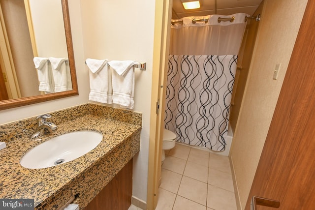 full bathroom featuring tile patterned flooring, toilet, shower / tub combo with curtain, and sink