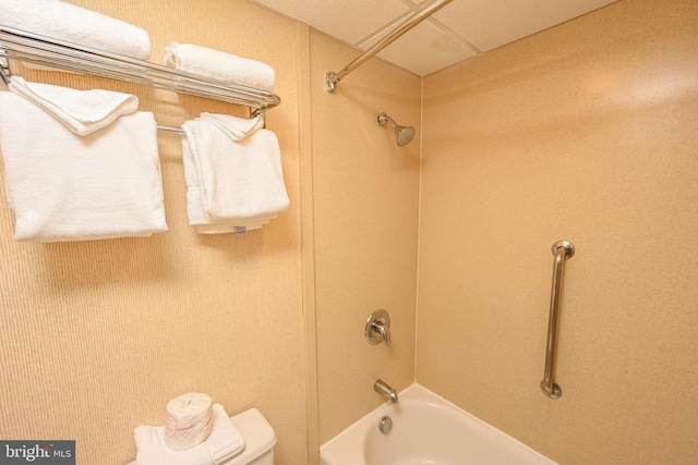 bathroom featuring toilet and shower / bath combination