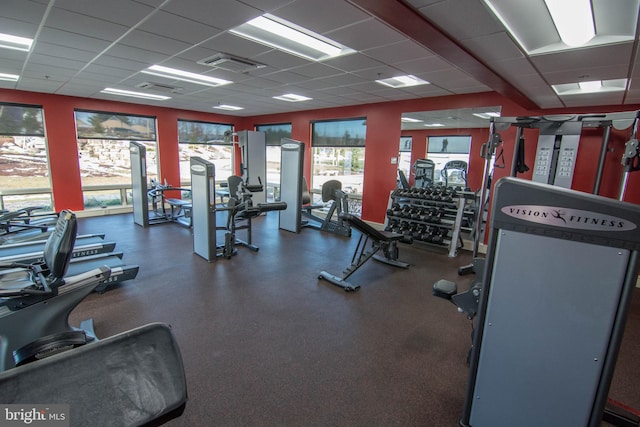 gym featuring a drop ceiling