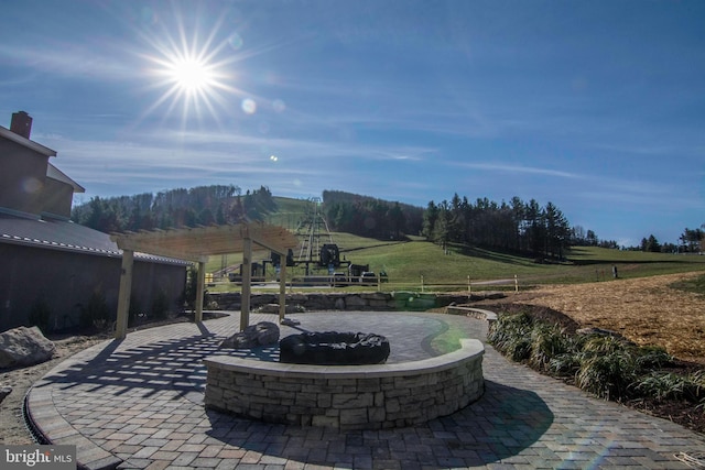 view of patio with a fire pit