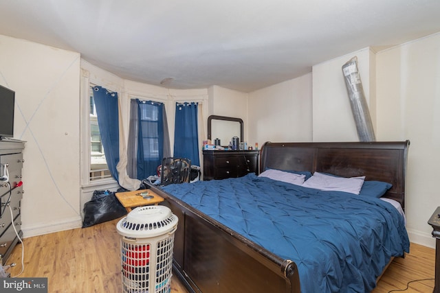 bedroom with light hardwood / wood-style flooring