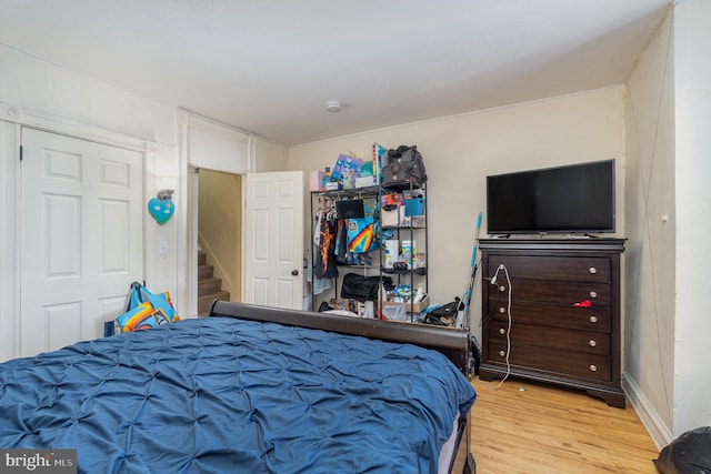 bedroom with light wood-type flooring