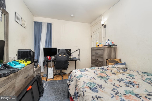 bedroom featuring hardwood / wood-style floors