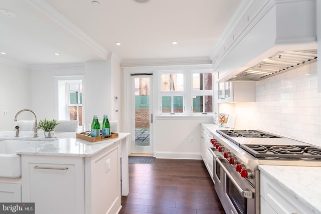 kitchen featuring white cabinetry and double oven range