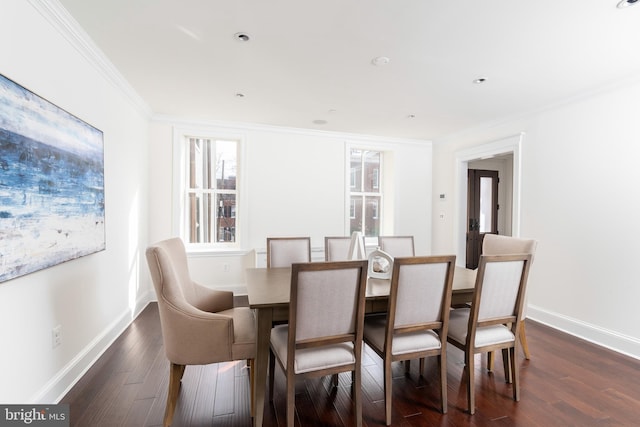 dining space featuring crown molding and dark hardwood / wood-style floors