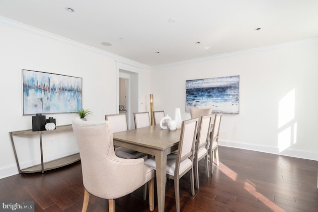 dining area featuring crown molding and dark wood-type flooring