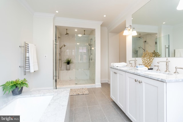 bathroom with crown molding, vanity, and a shower with door