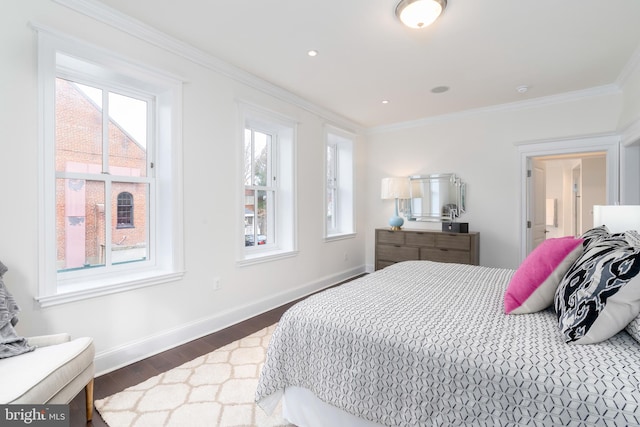 bedroom featuring ornamental molding and dark wood-type flooring