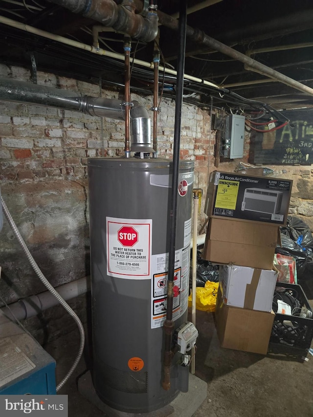 utility room with gas water heater