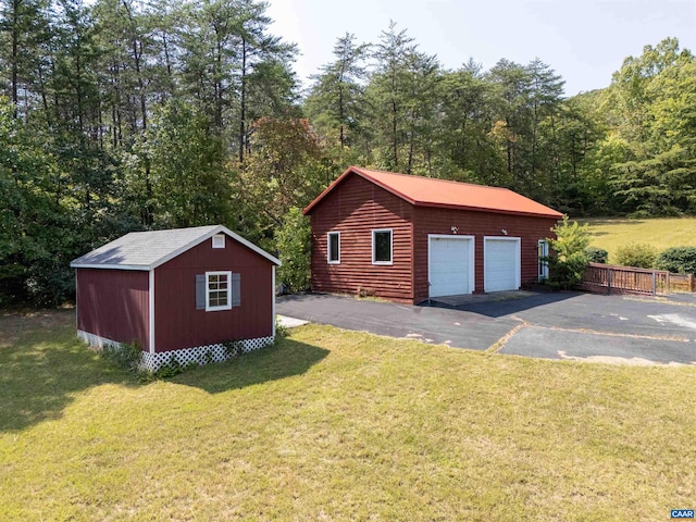 garage featuring a yard