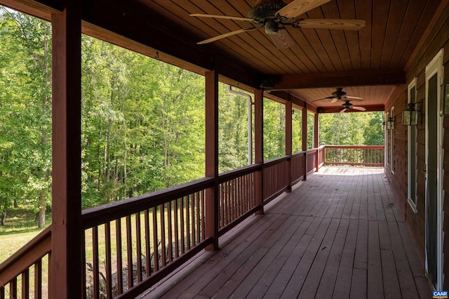 wooden deck featuring ceiling fan