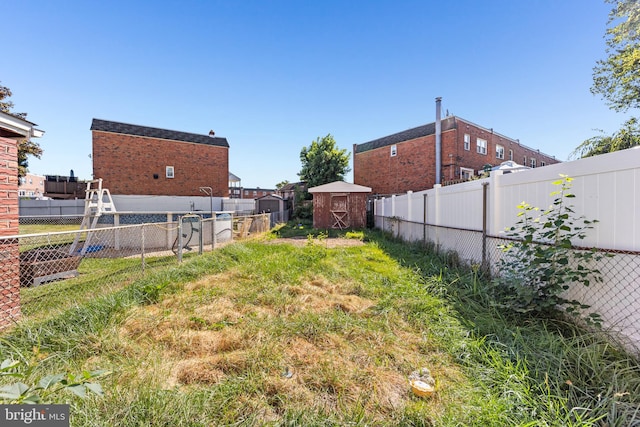 view of yard with a storage shed