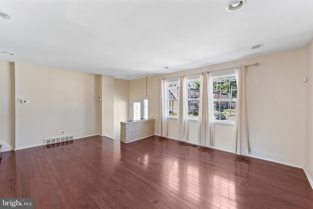 unfurnished room featuring dark hardwood / wood-style floors