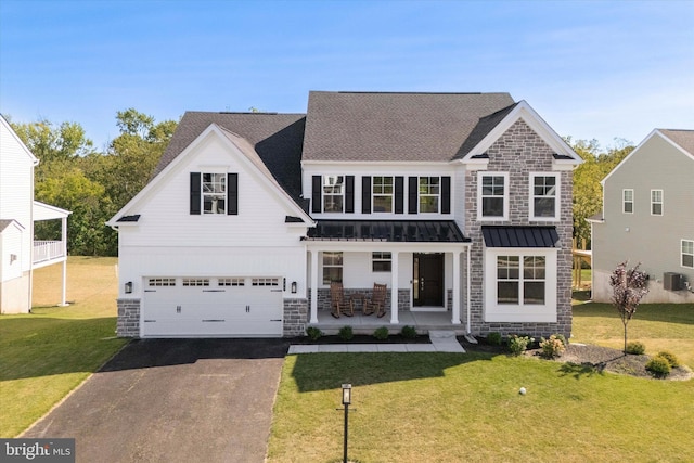 view of front of house featuring a front yard and a garage