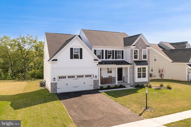 view of front facade featuring central AC, a front lawn, and a garage