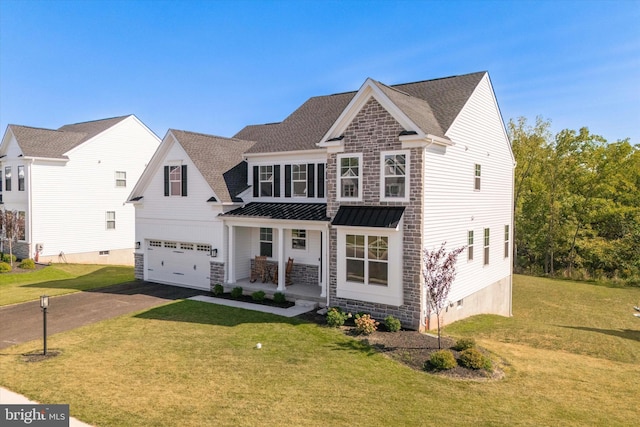 view of front of property featuring a garage and a front lawn