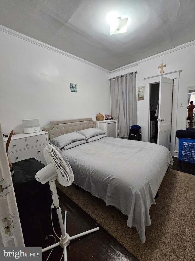 carpeted bedroom with ornamental molding